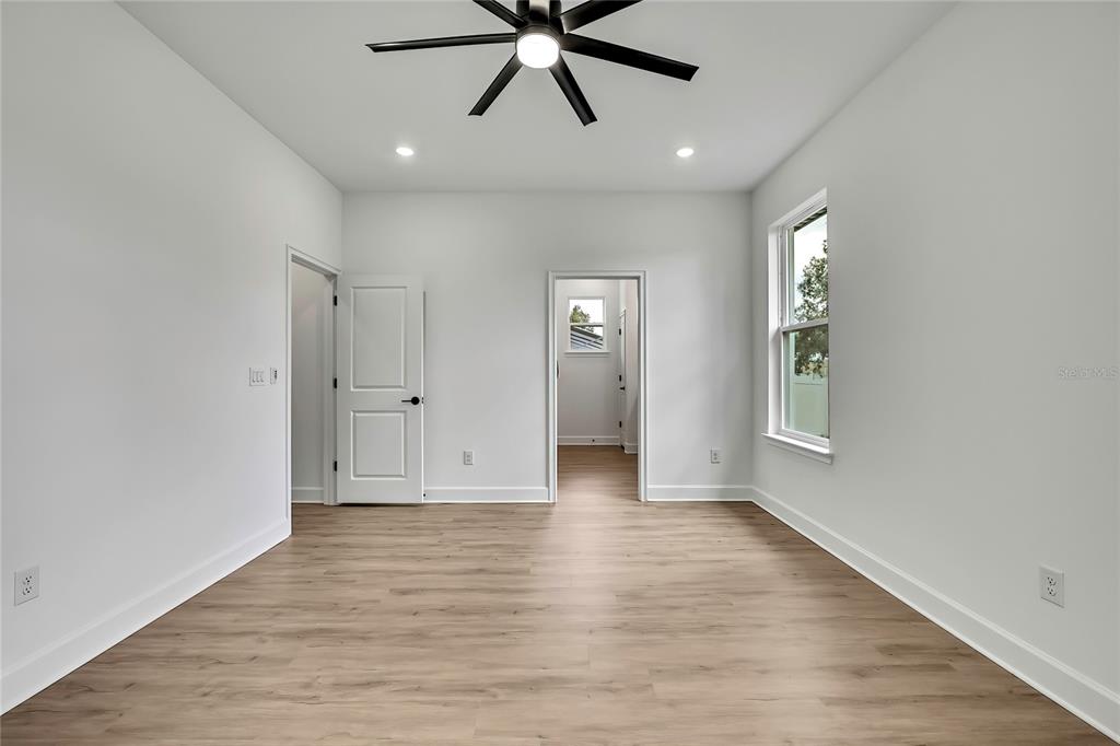 6589 Freeport Drive Spring Hill, FL 34608 - Photo 30 of 63 wooden floor in an empty room with a window