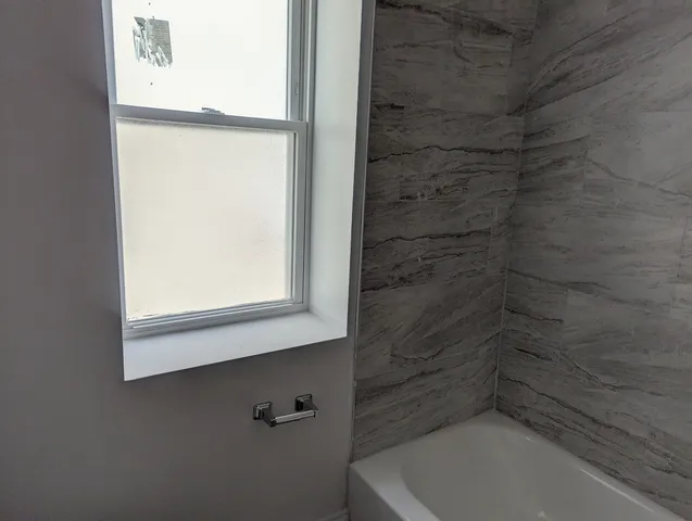 a bathroom with a bathtub