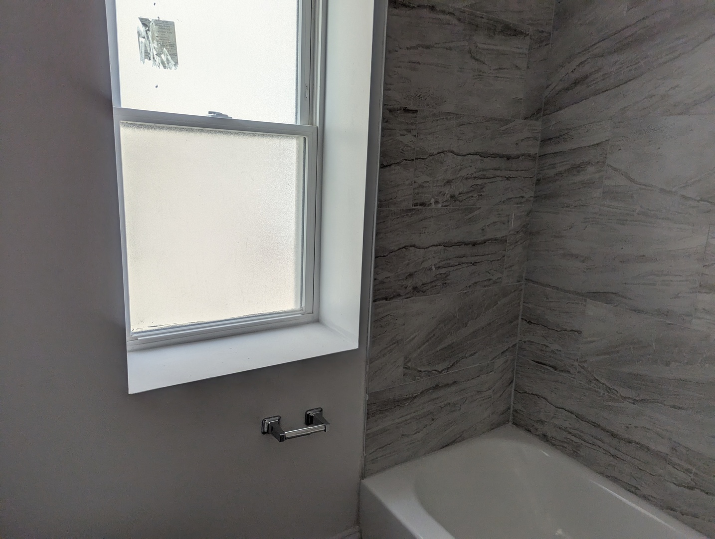 7936 South Champlain Avenue, Unit 1 Chicago, IL 60619 - Photo 7 of 8 a bathroom with a bathtub