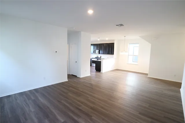 a view of a kitchen with a sink and a stove top oven