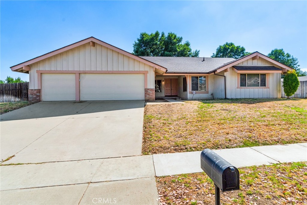 2114 North Apple Avenue Rialto, CA 92377 - Photo 1 of 1 a front view of a house with a yard