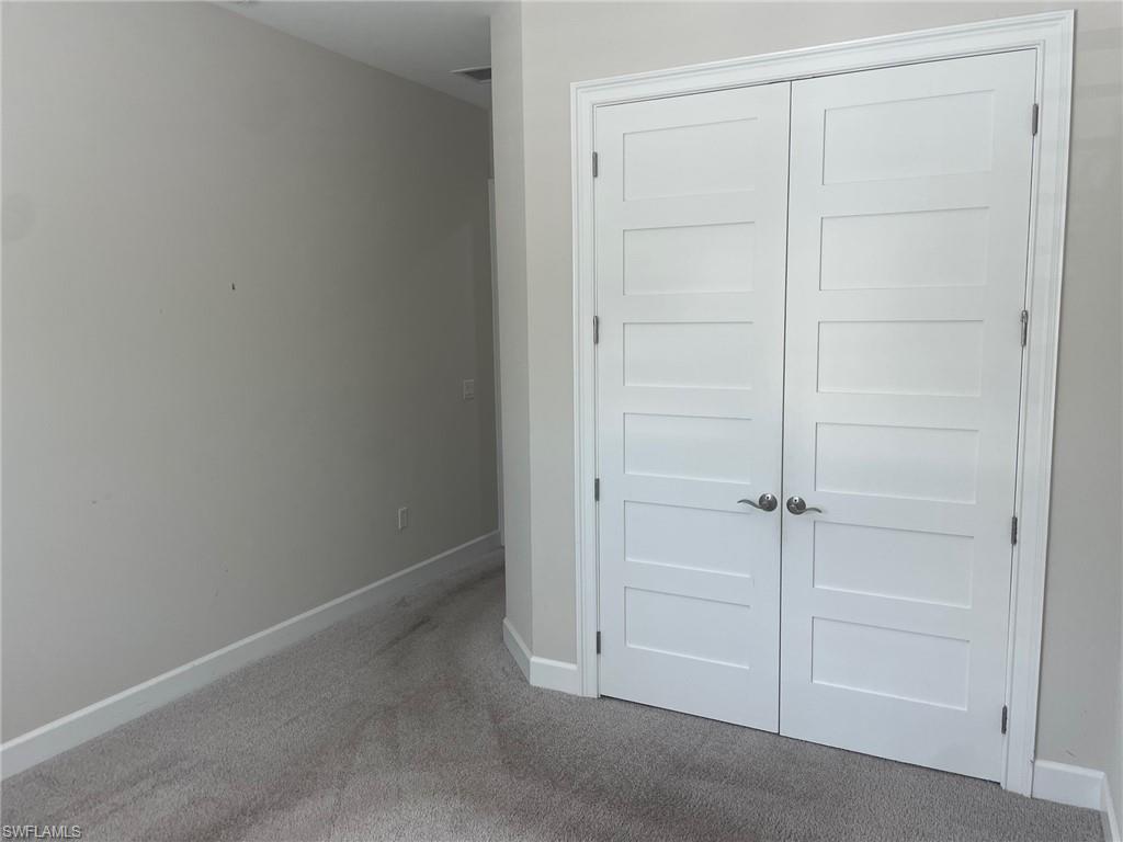 5685 Highbourne Drive Naples, FL 34113 - Photo 13 of 26 a view of an empty room