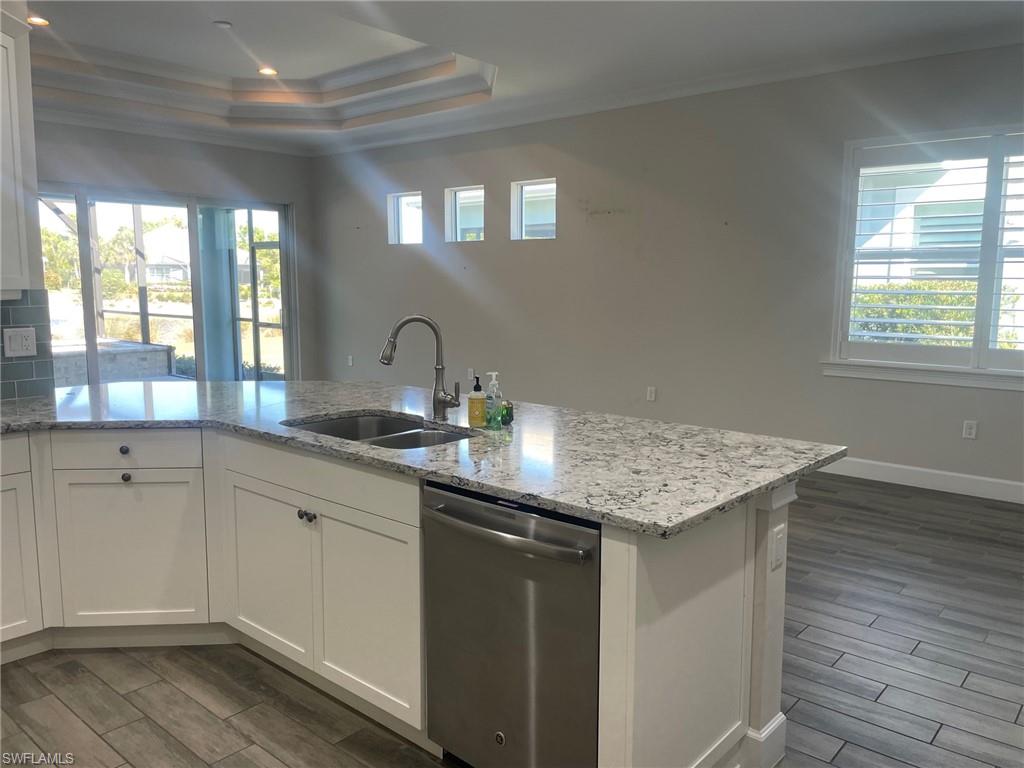 5685 Highbourne Drive Naples, FL 34113 - Photo 19 of 26 a kitchen with sink and window