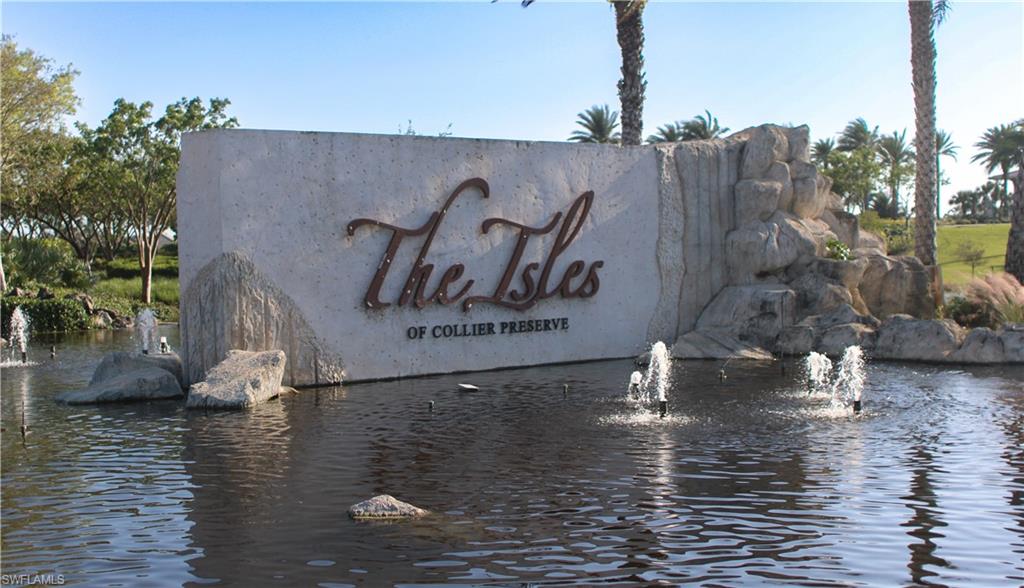 5685 Highbourne Drive Naples, FL 34113 - Photo 2 of 26 a view of a water with an umbrella