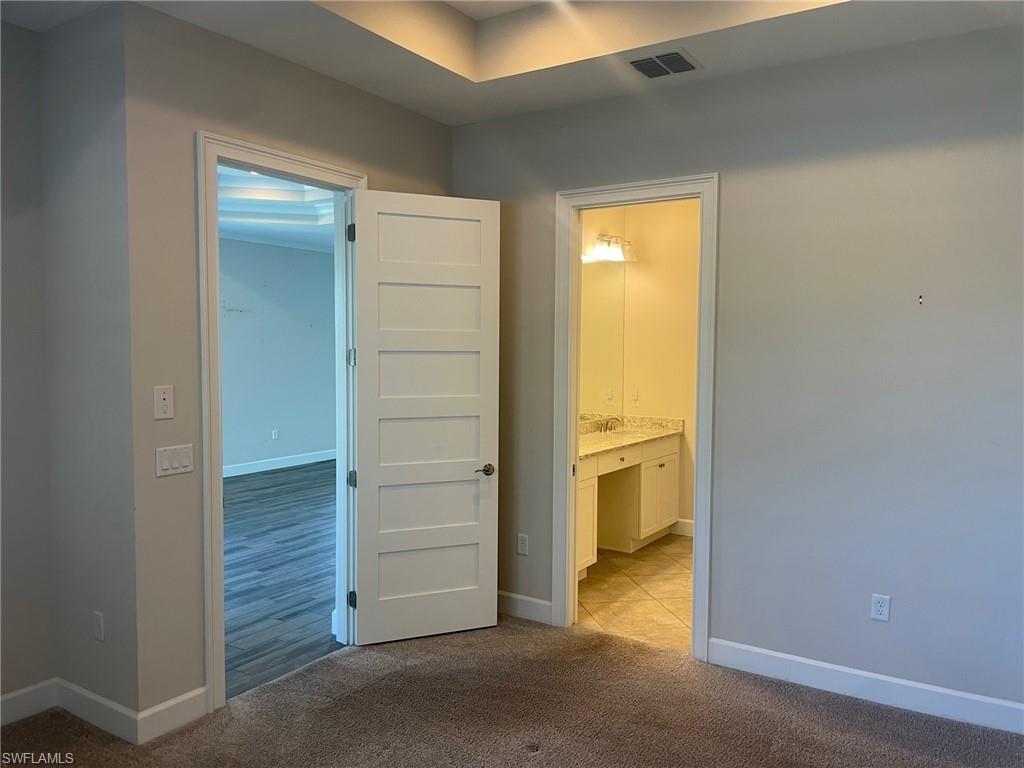 5685 Highbourne Drive Naples, FL 34113 - Photo 23 of 26 a view of an empty room