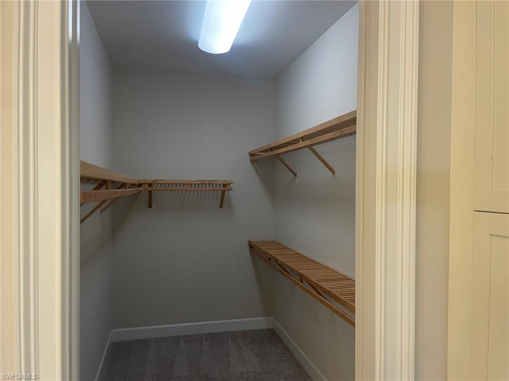5685 Highbourne Drive Naples, FL 34113 - Photo 25 of 26 a view of walk in closet