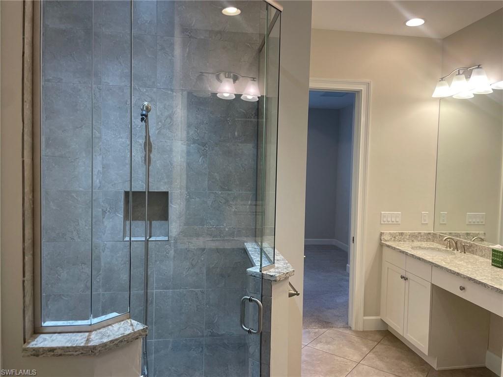 5685 Highbourne Drive Naples, FL 34113 - Photo 26 of 26 a bathroom with a shower and a sink