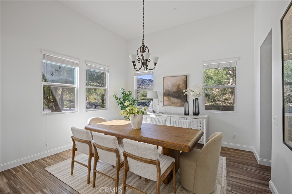 24910 Old Stone Way Stevenson Ranch, CA 91381 - Photo 12 of 67 a dining room with furniture and window