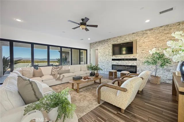a living room with furniture fireplace and a flat screen tv