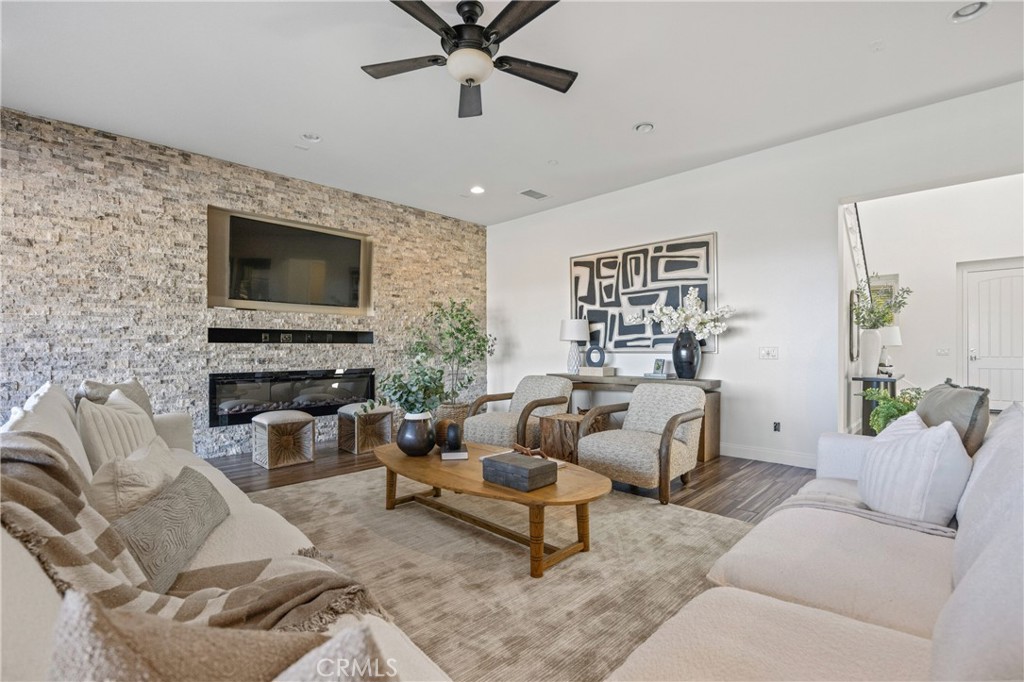 24910 Old Stone Way Stevenson Ranch, CA 91381 - Photo 17 of 67 a living room with furniture and a flat screen tv