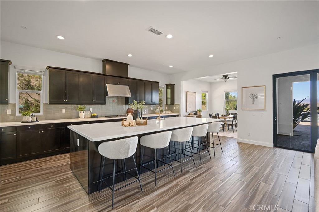 24910 Old Stone Way Stevenson Ranch, CA 91381 - Photo 20 of 67 a kitchen with a table and chairs in it