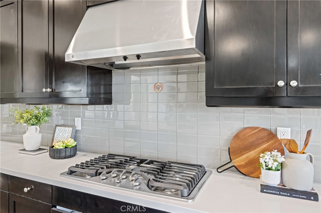 24910 Old Stone Way Stevenson Ranch, CA 91381 - Photo 24 of 67 a kitchen with a stove and a cabinets