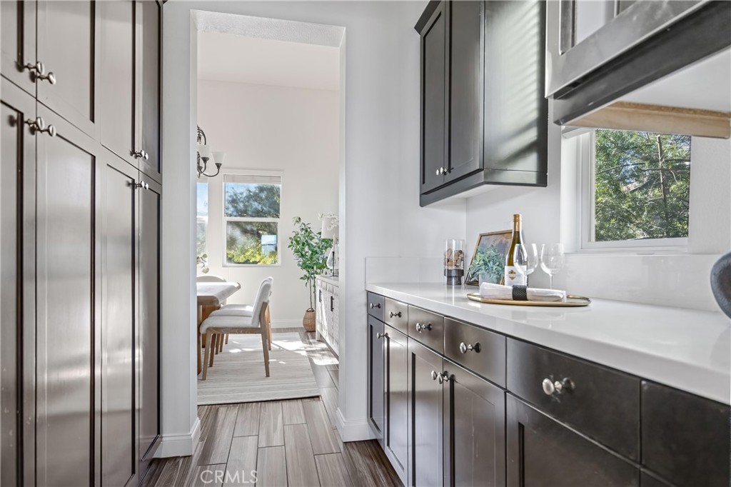 24910 Old Stone Way Stevenson Ranch, CA 91381 - Photo 25 of 67 a kitchen with stainless steel appliances granite countertop a sink a stove and refrigerator