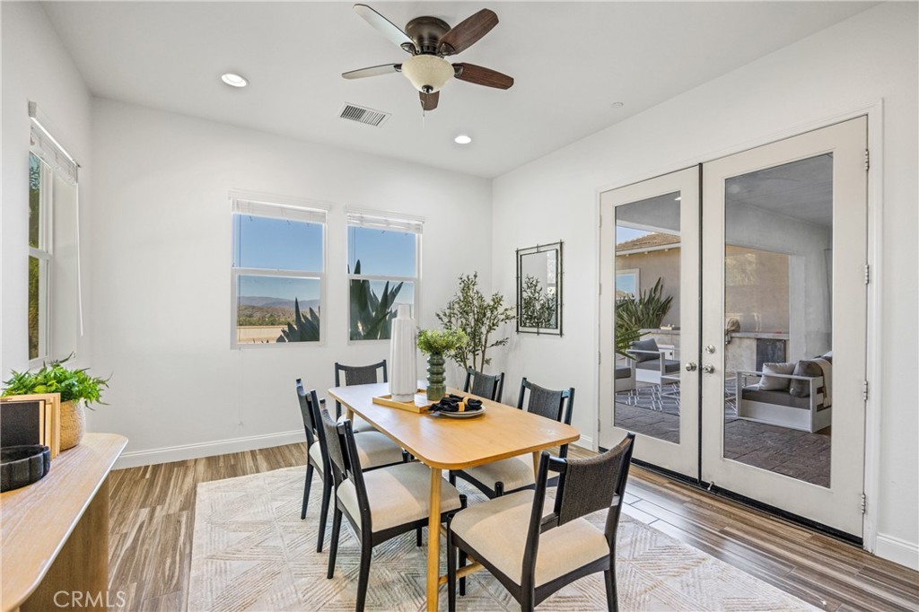 24910 Old Stone Way Stevenson Ranch, CA 91381 - Photo 26 of 67 a dining room with furniture and window