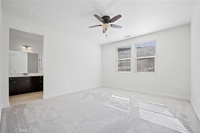 a view of a house with swimming pool and sitting area