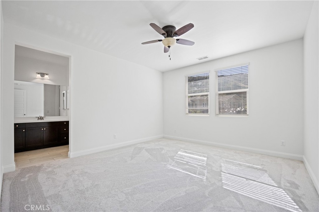 24910 Old Stone Way Stevenson Ranch, CA 91381 - Photo 44 of 67 a view of an empty room with a window