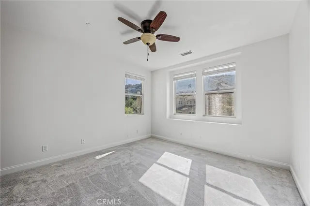 a view of a chairs and table in patio