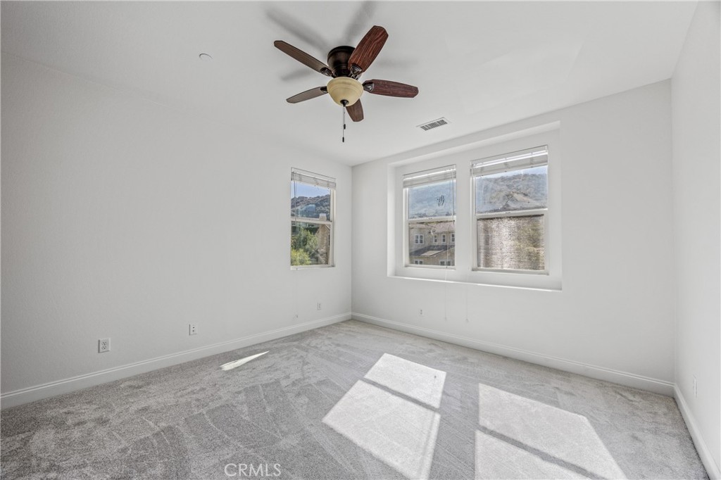 24910 Old Stone Way Stevenson Ranch, CA 91381 - Photo 47 of 67 a view of an empty room with a window