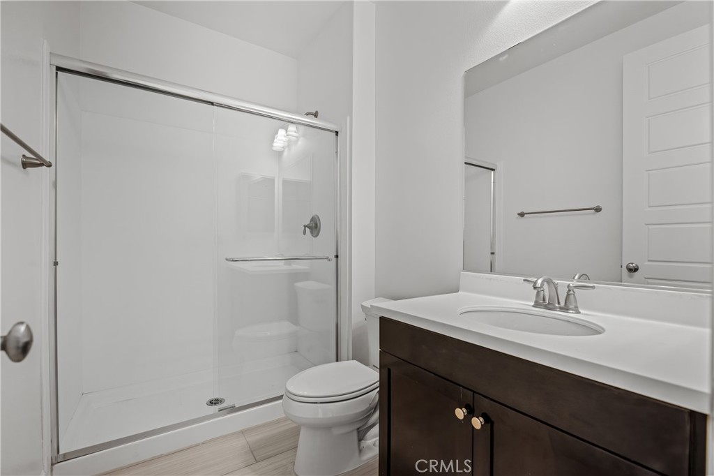 24910 Old Stone Way Stevenson Ranch, CA 91381 - Photo 48 of 67 a bathroom with a sink a toilet and shower
