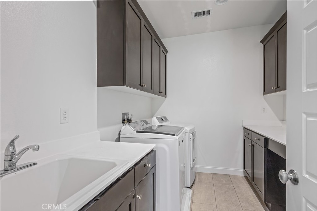 24910 Old Stone Way Stevenson Ranch, CA 91381 - Photo 49 of 67 a bathroom with a sink and a mirror