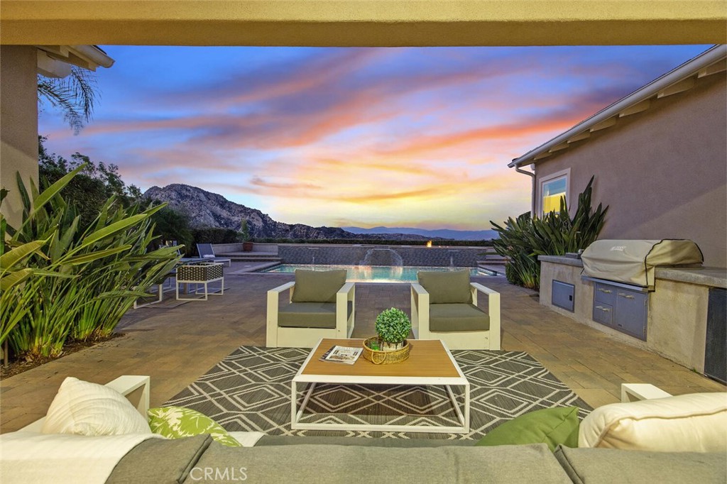 24910 Old Stone Way Stevenson Ranch, CA 91381 - Photo 60 of 67 a view of a chairs and table in patio
