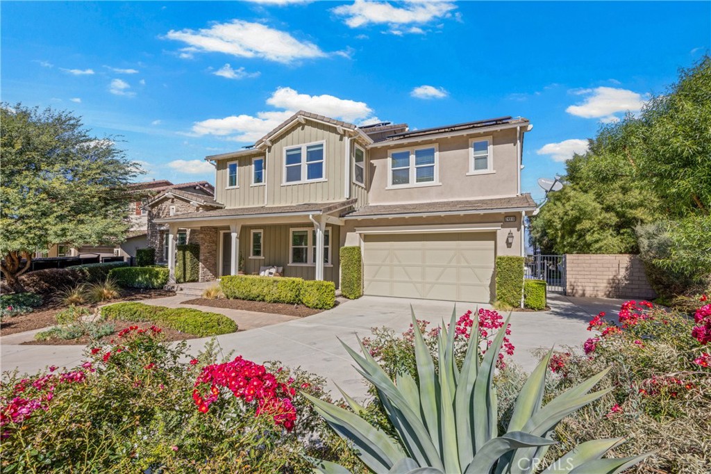 24910 Old Stone Way Stevenson Ranch, CA 91381 - Photo 6 of 67 a front view of a house with a yard