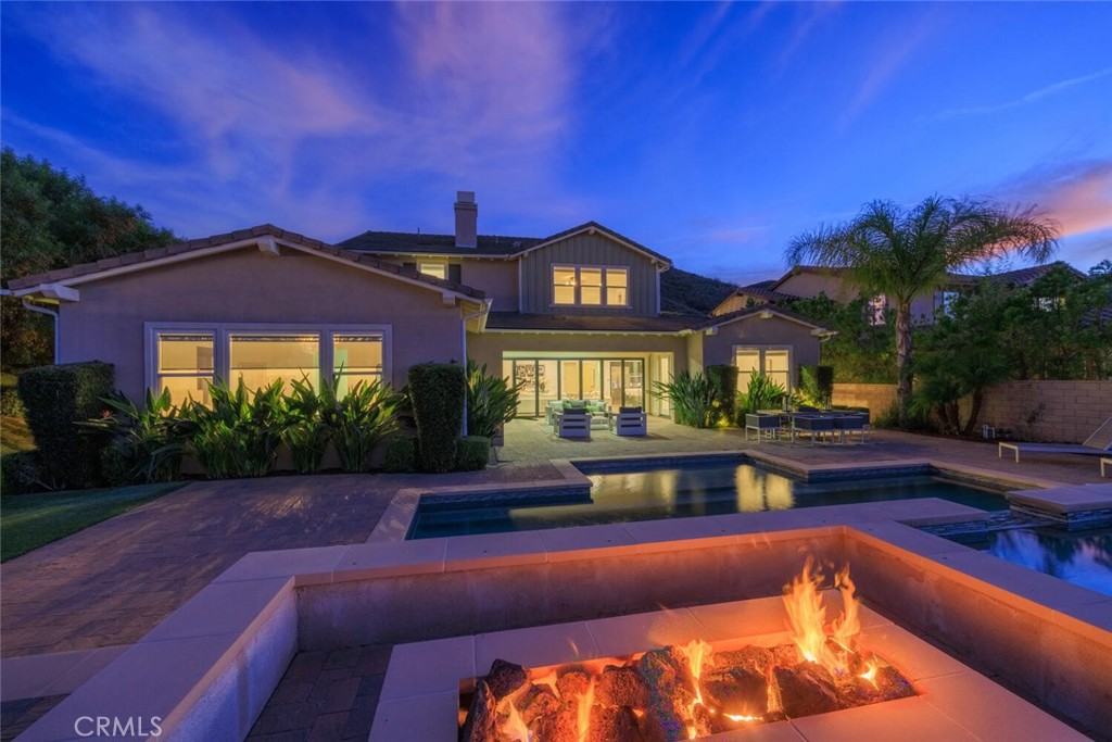 24910 Old Stone Way Stevenson Ranch, CA 91381 - Photo 64 of 67 a view of a house with swimming pool yard and outdoor seating