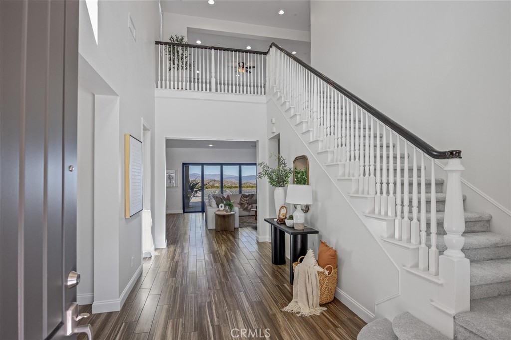 24910 Old Stone Way Stevenson Ranch, CA 91381 - Photo 10 of 67 a view of entryway and hall with wooden floor