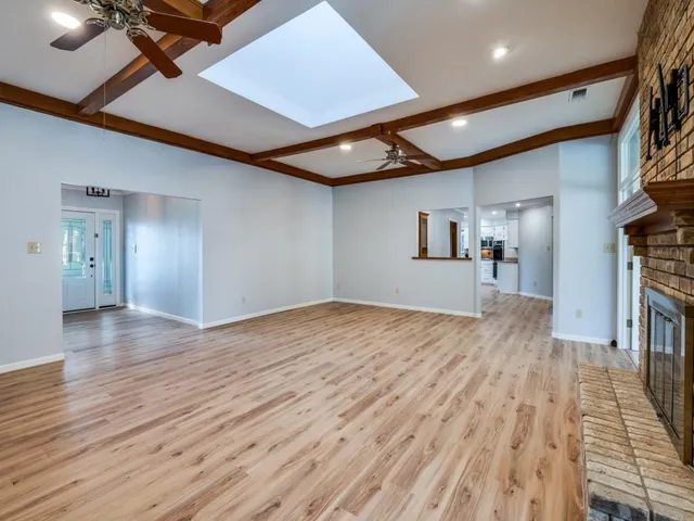 a bathroom with a double vanity sink a mirror and a bathtub