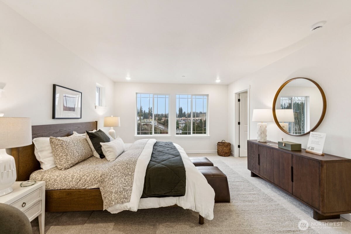 24233 13 Avenue Southeast, Unit CR26 Bothell, WA 98021 - Photo 11 of 21 a bedroom with a large bed and a large window