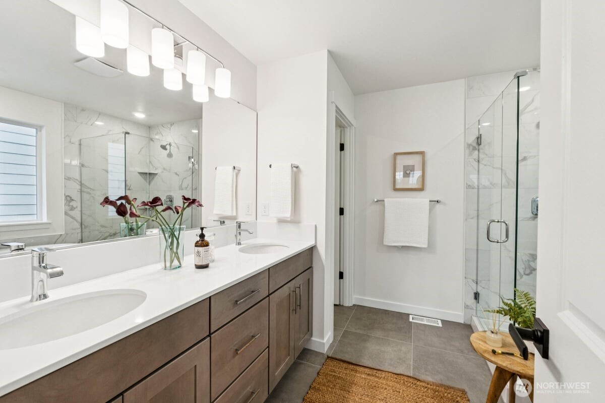 24233 13 Avenue Southeast, Unit CR26 Bothell, WA 98021 - Photo 13 of 21 a spacious bathroom with a double vanity sink mirror and shower
