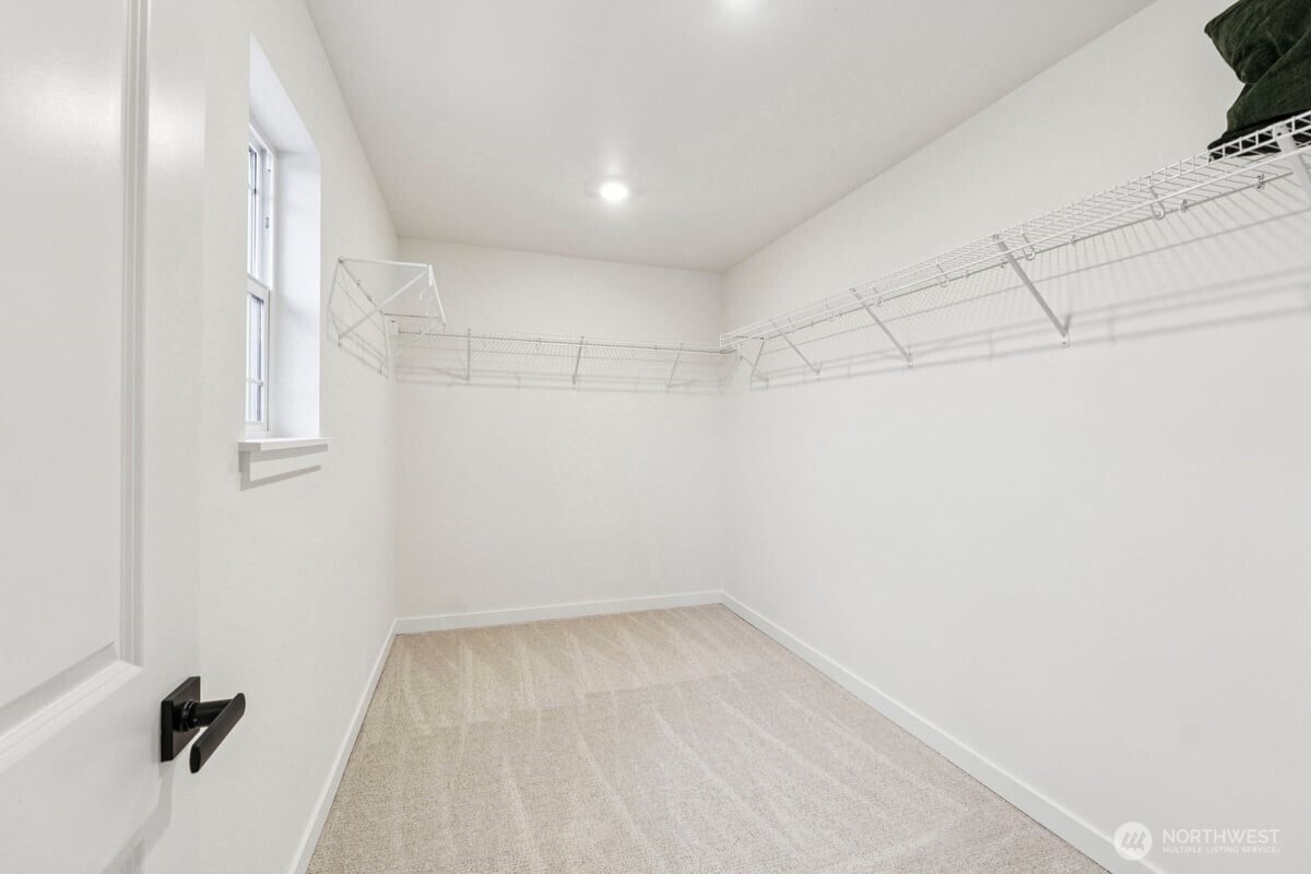 24233 13 Avenue Southeast, Unit CR26 Bothell, WA 98021 - Photo 14 of 21 a view of a room with racks on the wall