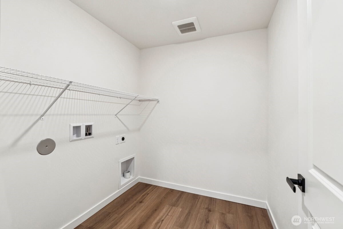 24233 13 Avenue Southeast, Unit CR26 Bothell, WA 98021 - Photo 18 of 21 a view of a room with racks on the wall
