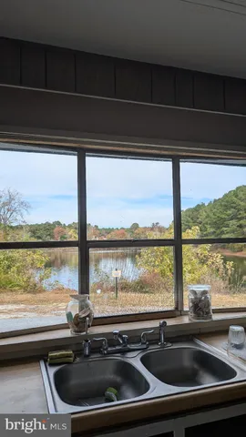 a bathroom with a sink and a large window