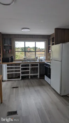 a kitchen with stainless steel appliances a stove and a refrigerator