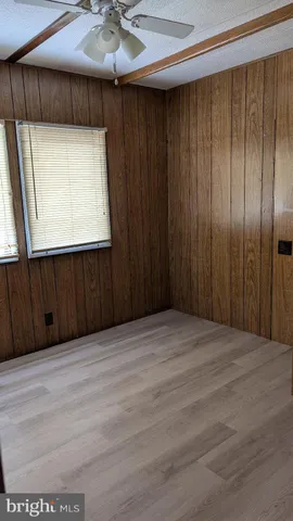 a view of a hallway with a wooden door