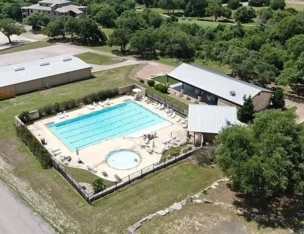 a view of a swimming pool with a lake view