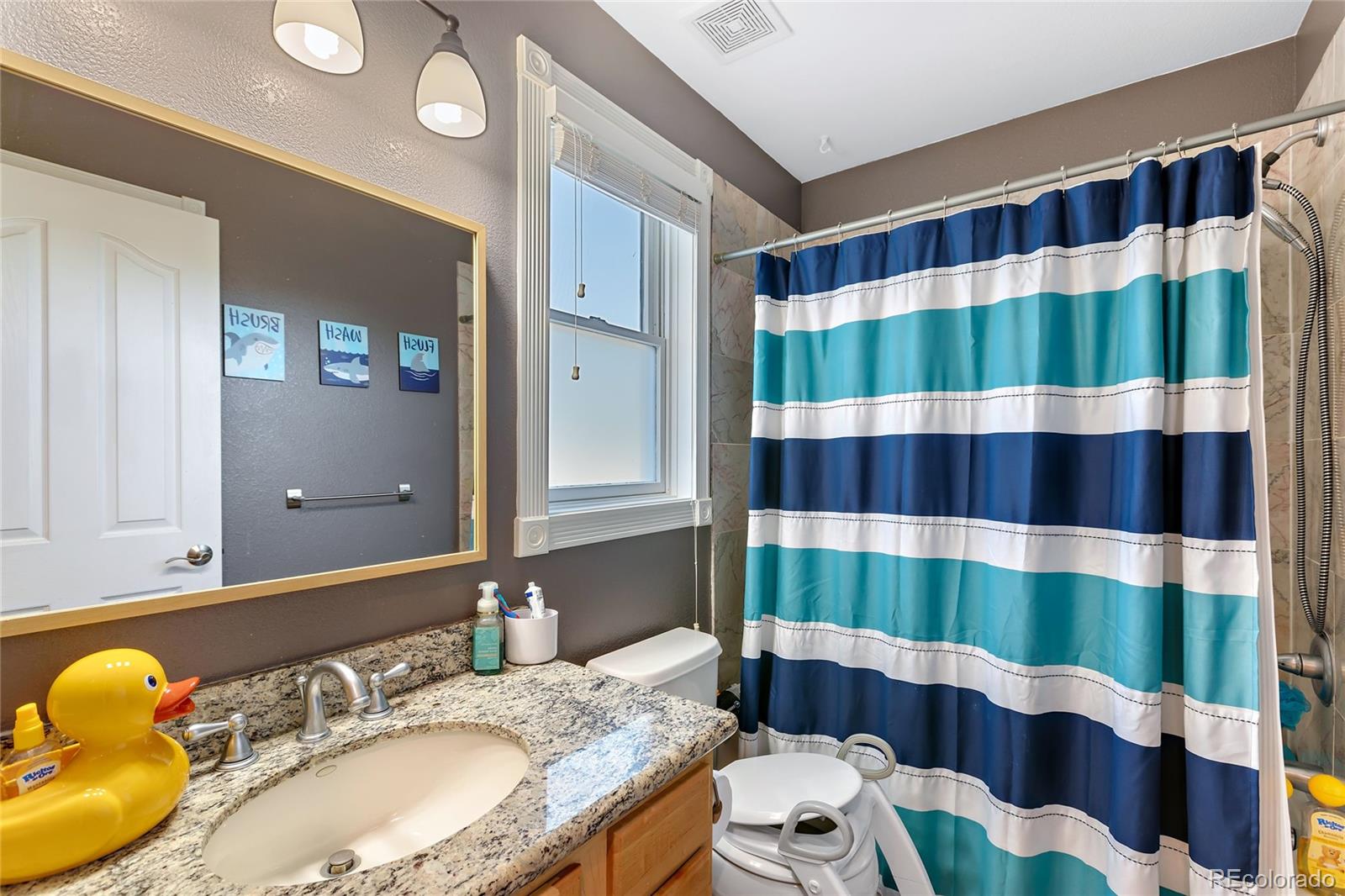 5546 Drake Street Frederick, CO 80504 - Photo 11 of 25 a bathroom with a sink and a mirror