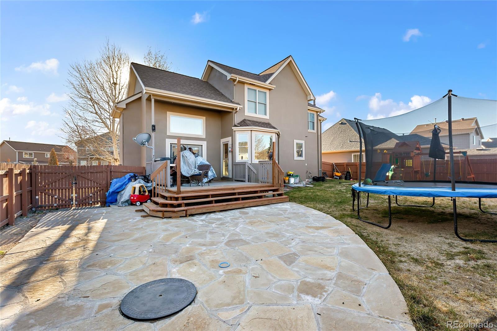 5546 Drake Street Frederick, CO 80504 - Photo 21 of 25 a view of a house with a chairs in patio
