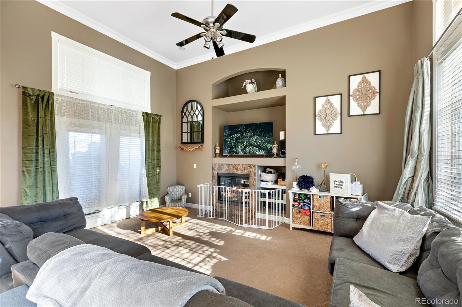 5546 Drake Street Frederick, CO 80504 - Photo 3 of 25 a living room with furniture and a large window