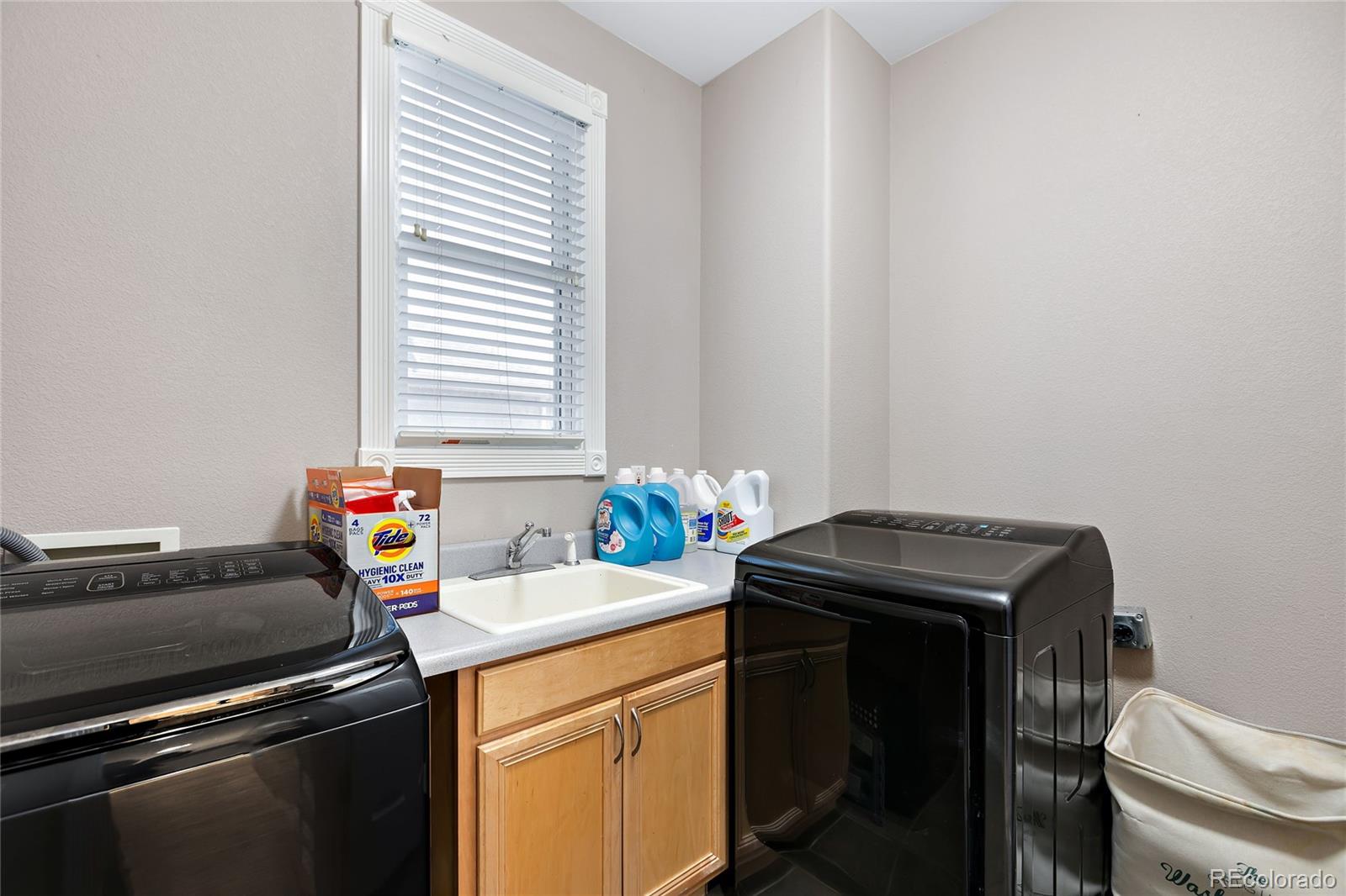 5546 Drake Street Frederick, CO 80504 - Photo 9 of 25 a utility room with dryer and washer