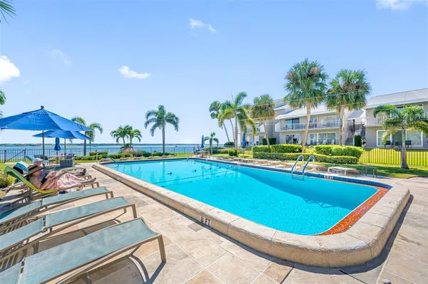 a view of swimming pool with outdoor seating