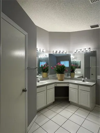 a kitchen with a sink and refrigerator