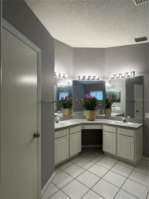 12633 Early Run Lane Riverview, FL 33578 - Photo 12 of 44 a kitchen with a sink and refrigerator