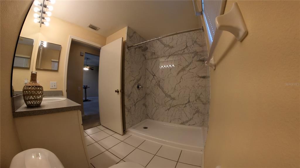 12633 Early Run Lane Riverview, FL 33578 - Photo 16 of 44 a bathroom with a shower and a sink
