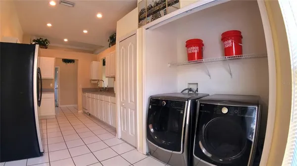 a view of a livingroom with furniture and a flat screen tv