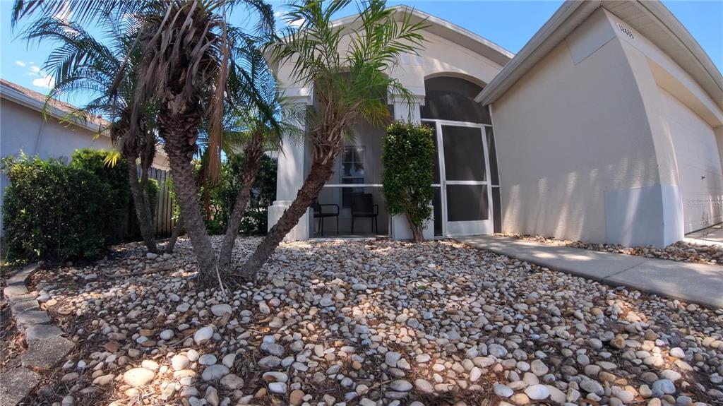 12633 Early Run Lane Riverview, FL 33578 - Photo 36 of 44 a backyard of a house with lots of green space