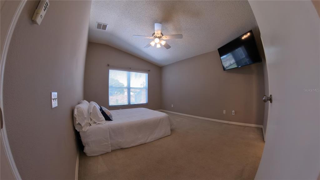 12633 Early Run Lane Riverview, FL 33578 - Photo 9 of 44 a bedroom with bed and window