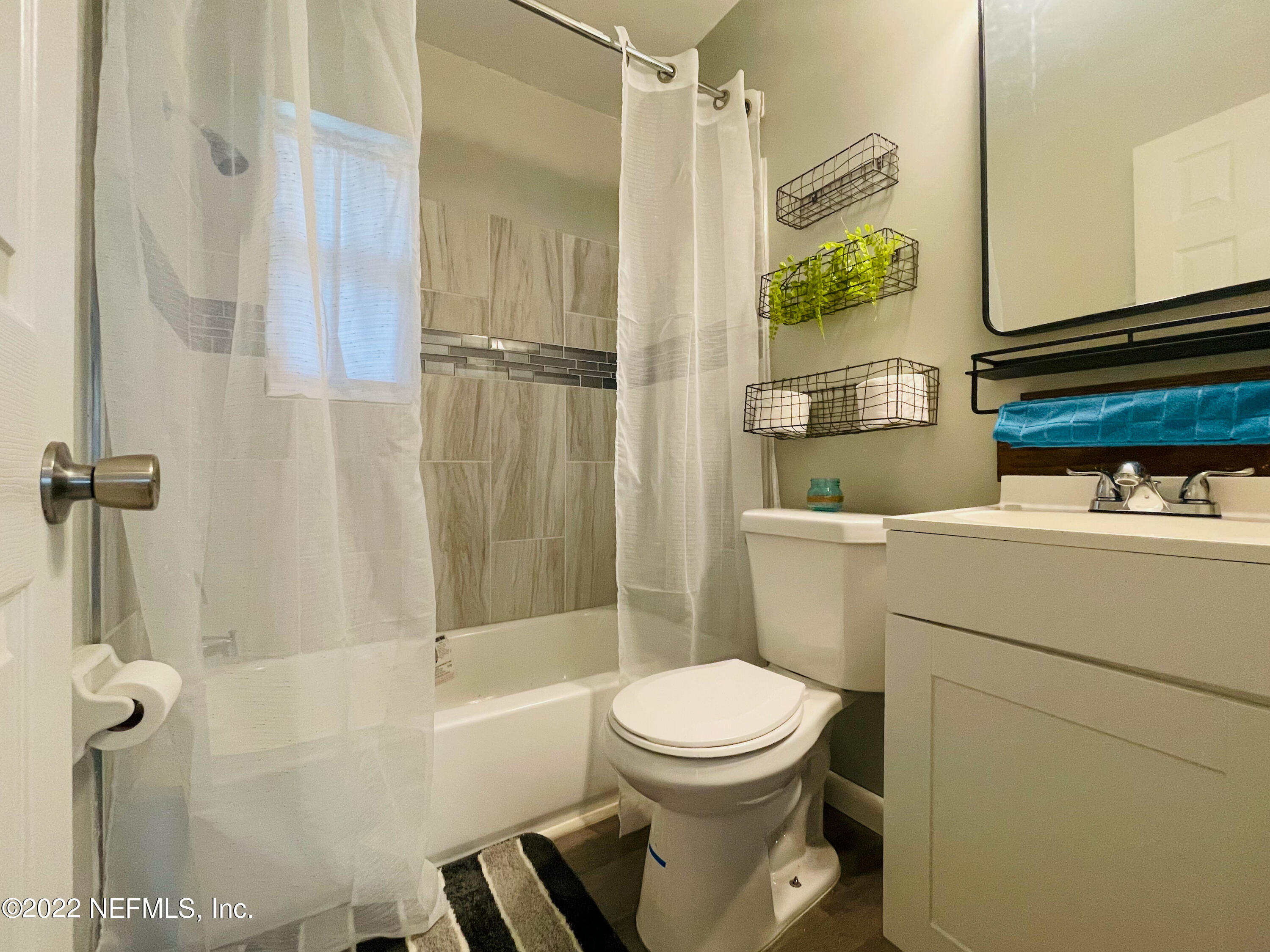 3151 Brasque Drive Jacksonville, FL 32209 - Photo 13 of 18 a bathroom with a toilet and a shower