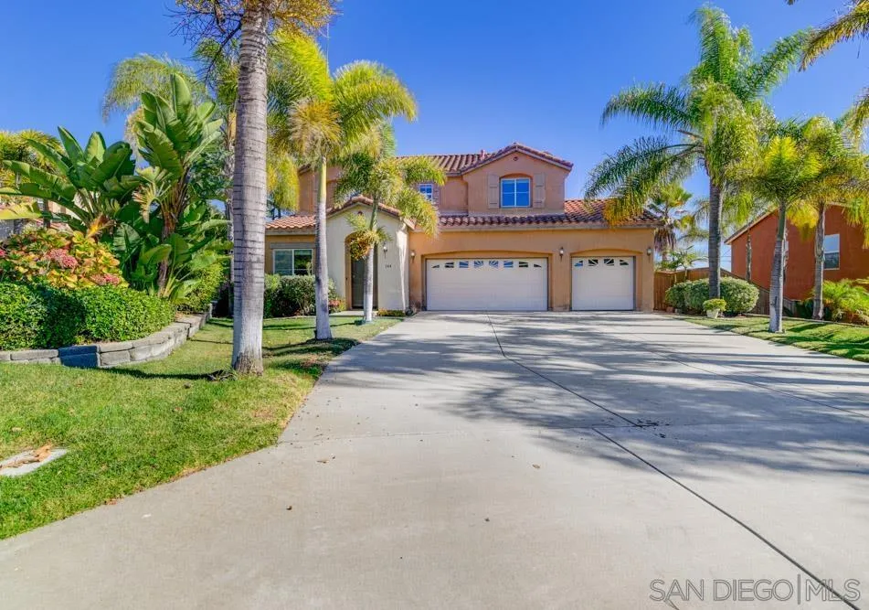 344 Natalie Way Fallbrook, CA 92028 - Photo 1 of 37 a view of a house with a yard and palm trees